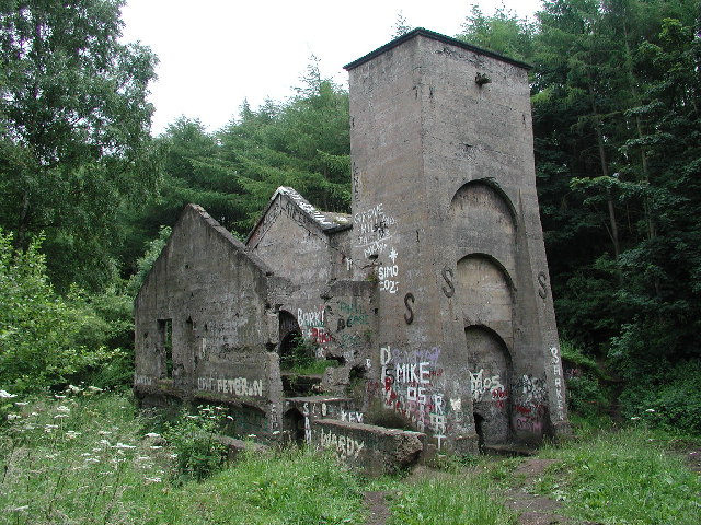 A brick Guibal fan house on a Yorkshire hillside, its walls braced with S-shaped steel ties