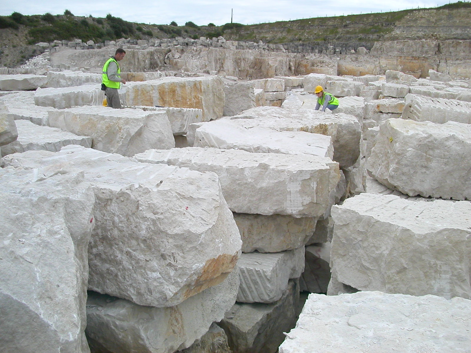 Blocks of quarried Portland stone at Coombefield, Isle of Portland, Dorset — a classic English freestone, sawn into regular blocks for building.
