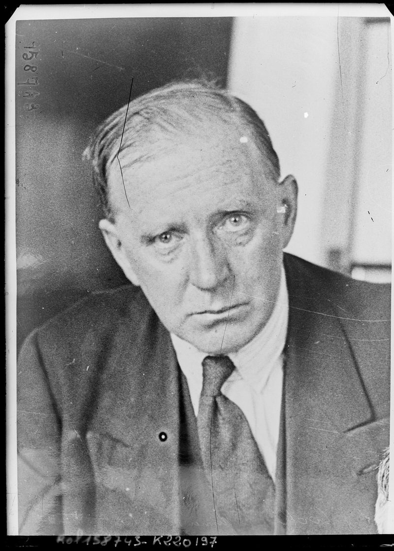 Head and shoulders portrait of A. J. Cook in a jacket and tie, looking at the camera, from a 1931 press photograph.