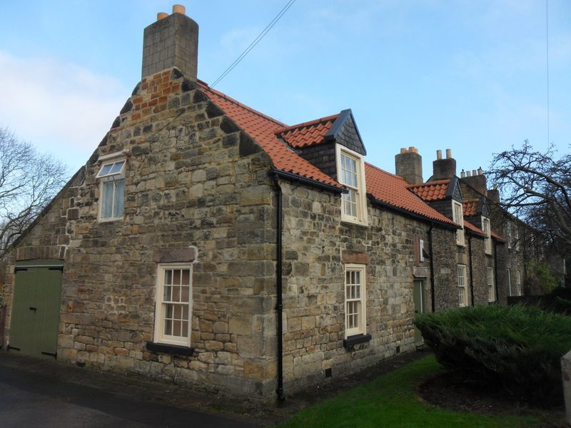 Whitewashed Dial Cottage on the Great Lime Road at West Moor, Stephenson's home, with the sundial above the door