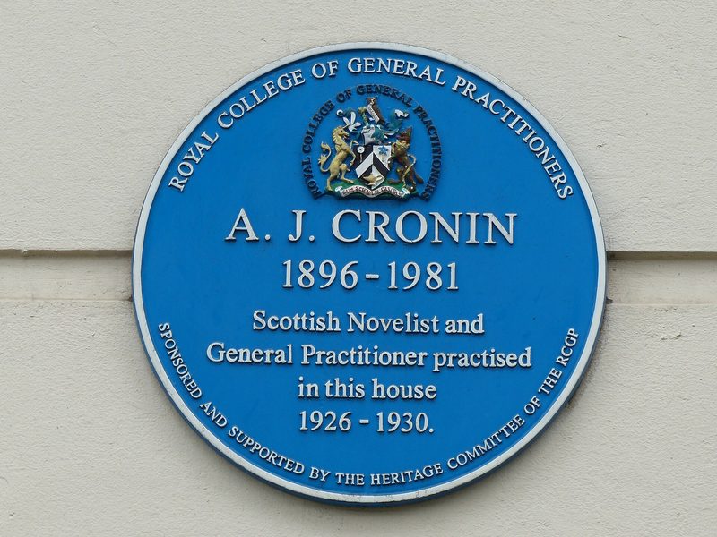 Round blue plaque reading A. J. Cronin 1896-1981, Scottish novelist and general practitioner, practised in this house 1926-1930