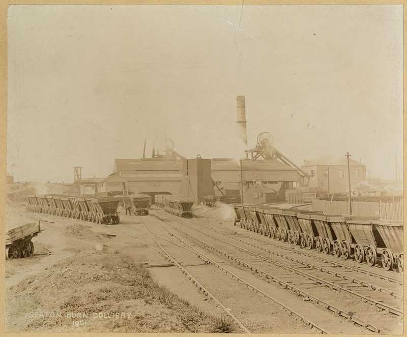 A black-and-white photograph of Seaton Burn Colliery's buildings and headgear in 1901.