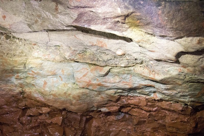 An underground passage cut through red sandstone in Wood Mine at Alderley Edge.