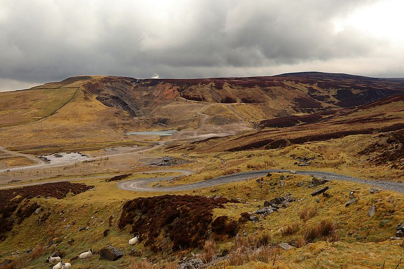 The disused opencast workings at Closehouse in Lunedale, pale spoil and worked ground on the flank of the fell.