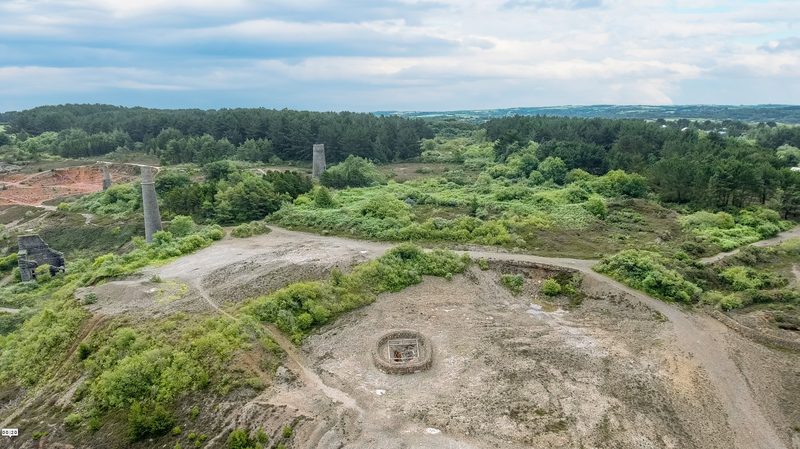 The clock tower and capped shafts at the former Wheal Maid site, part of Consolidated Mines.