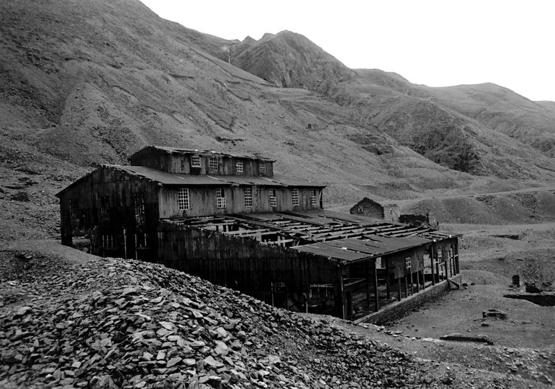 The same buildings photographed in June 1977, with noticeably more structure standing than survives today.