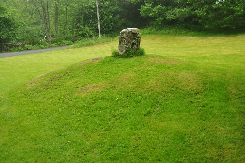 The Carreg Pumsaint stone, its overlapping oval hollows thought to have been worn by a Roman water-powered trip hammer crushing ore.
