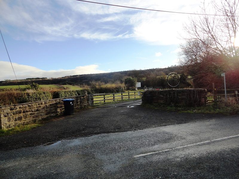 A narrow tarmac lane running between hedgerows and bare winter trees at West Edmondsley, the hamlet beside which the colliery stood.