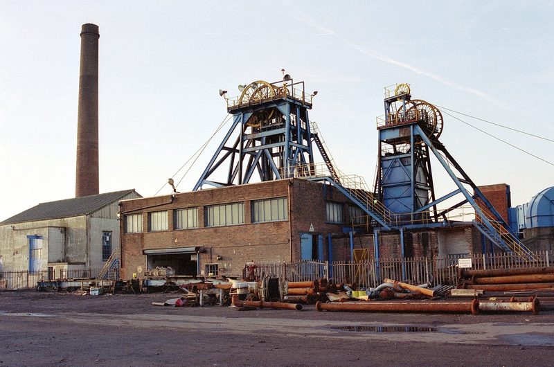 The headgear, winding house and surface buildings of Ellistown Colliery standing under a winter sky, with colliery yard and plant in the foreground.