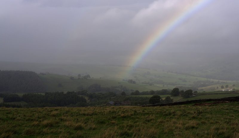 Open heather moorland under a rainbow near Greenhow Hill above Pateley Bridge.