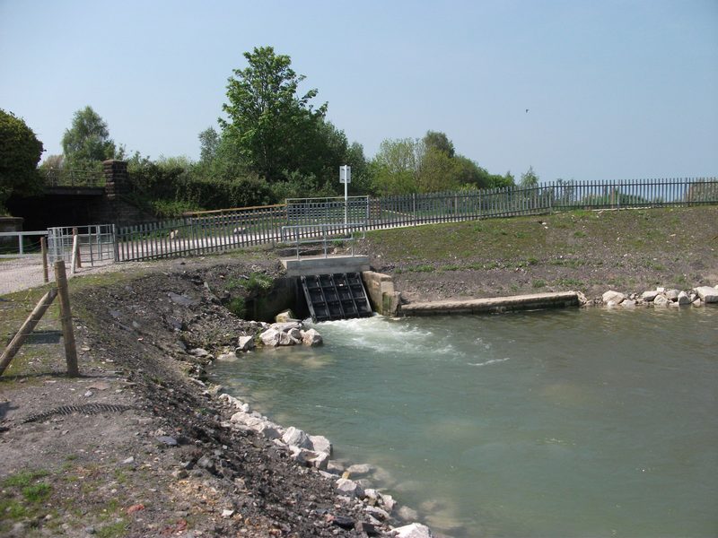 A clapper valve on the Milwr Tunnel sluice, part of the drainage system that still discharges water from beneath Halkyn Mountain.
