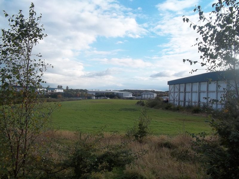 Modern industrial units and access roads on a large flat estate