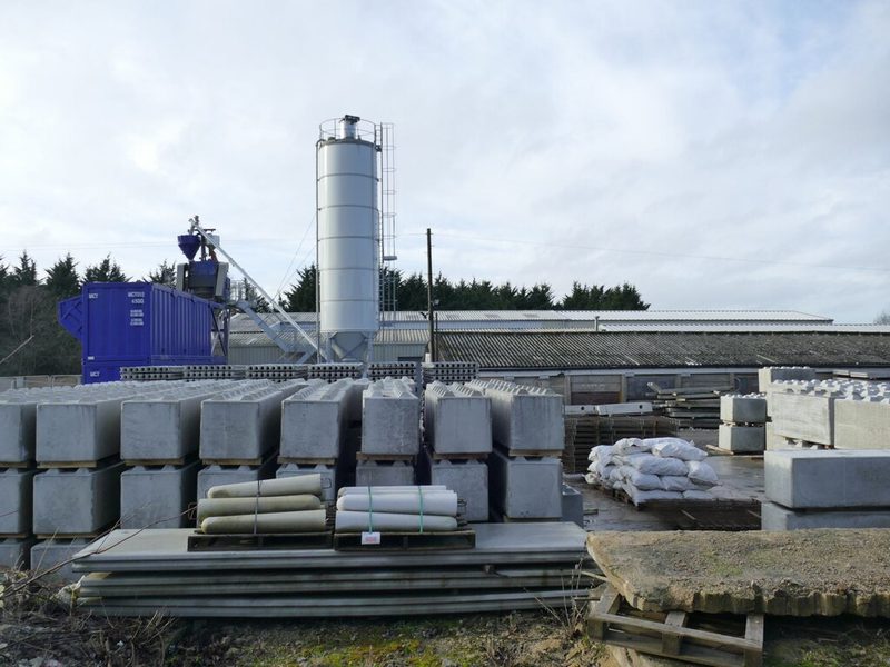 Stacked precast concrete blocks and a cement silo at an industrial estate on Ash Lane, Garforth, on the site of the former Isabella Pit.