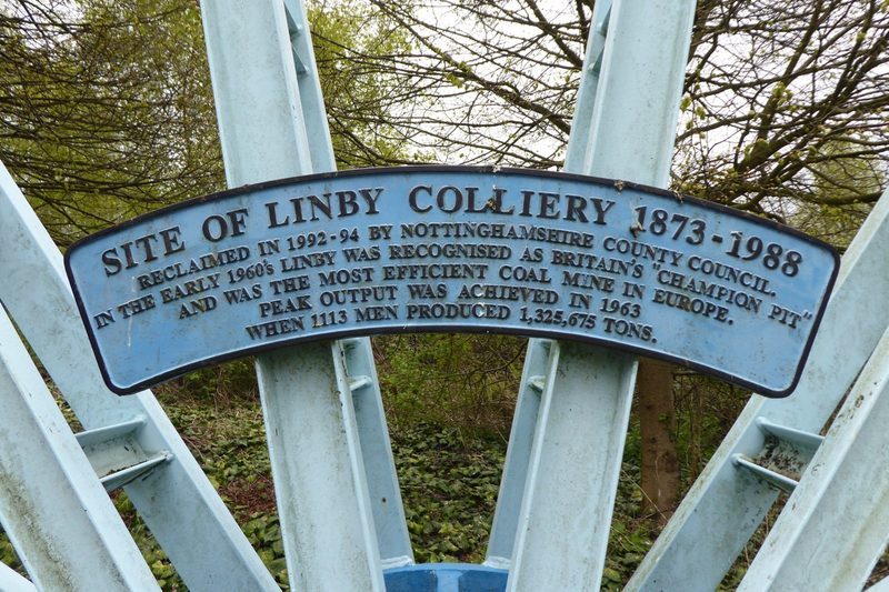 A memorial plaque set on a stone base on the cleared colliery site, recording Linby Colliery 1873 to 1988 and its Champion Pit years.