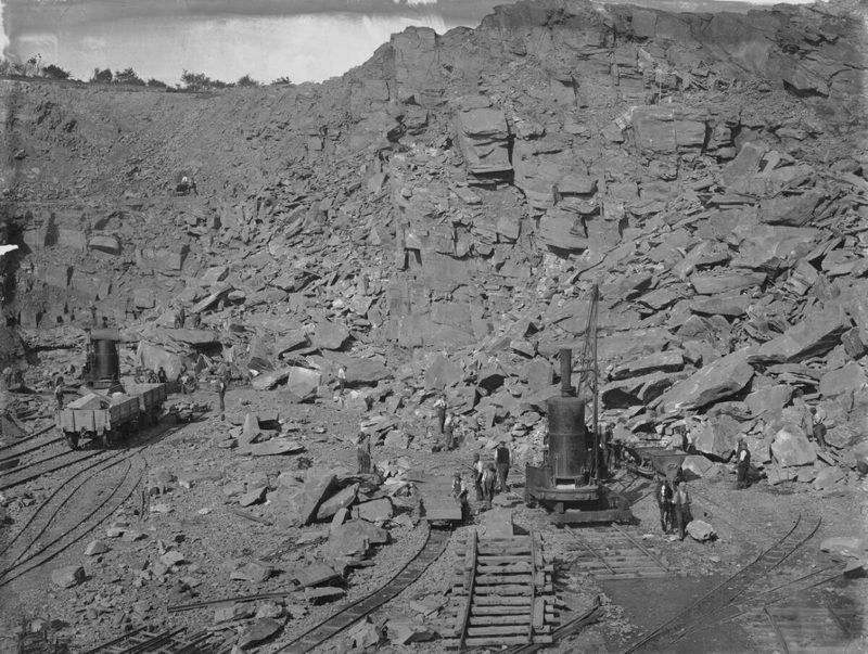A 1905 photograph of the Llanbradach quarries, showing the worked stone faces above the Rhymney Valley.