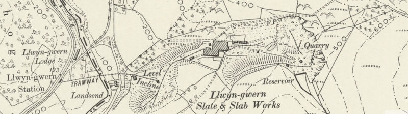 Ordnance Survey map extract showing the quarry pit, mill, reservoir and the Corris Railway branch crossing the river