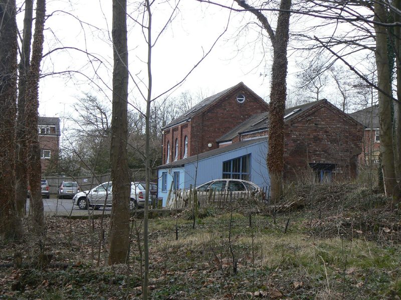Two restored brick colliery buildings at the site of Lady Pit, the capstan house nearer the camera and the winding engine house behind, now in office use.