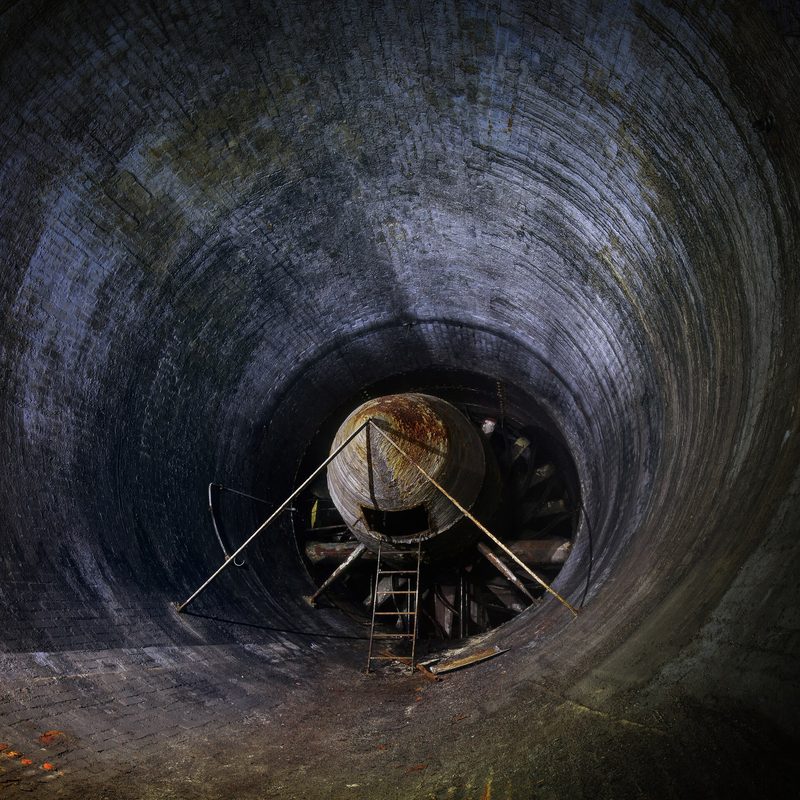 One of the large ventilation fans in the western lung of Spring Quarry, set in a rock-cut passage underground at Corsham.