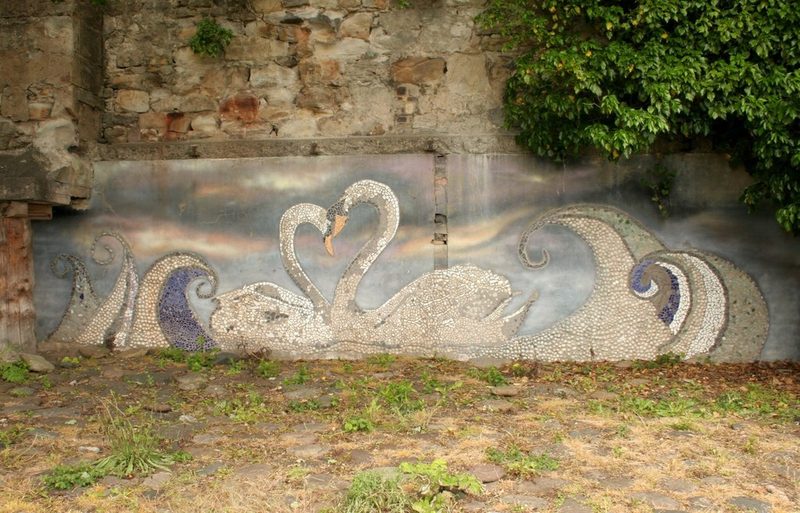 Mosaic of two swans and waves on a wall at the old entrance to the former Victoria Pit at West Wemyss.
