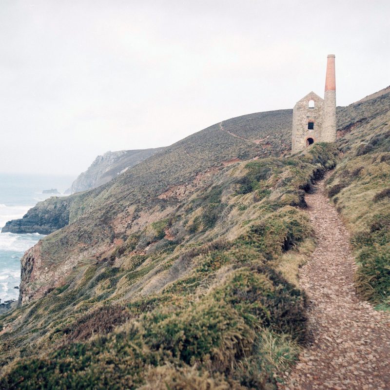 The 1872 Towanroath pumping engine house standing on the cliff face below the main Wheal Coates workings.