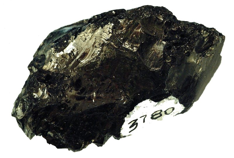 A lump of anthracite coal showing its hard, glossy, semi-metallic black surface and conchoidal fracture
