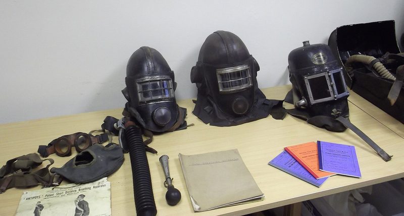 A set of early closed-circuit mines rescue breathing apparatus, harness, cylinder and breathing bag, displayed at the Houghton-le-Spring rescue station.