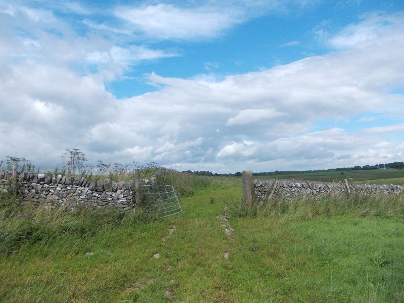 The Long Rake calcite works near Youlgreave seen across a field gate, the processing plant that outlived the mine