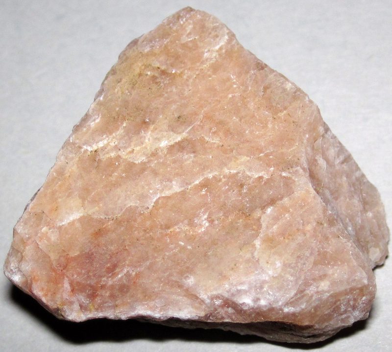 A whitish-pink specimen of potassium feldspar, the flux mineral used in porcelain and glass manufacture.