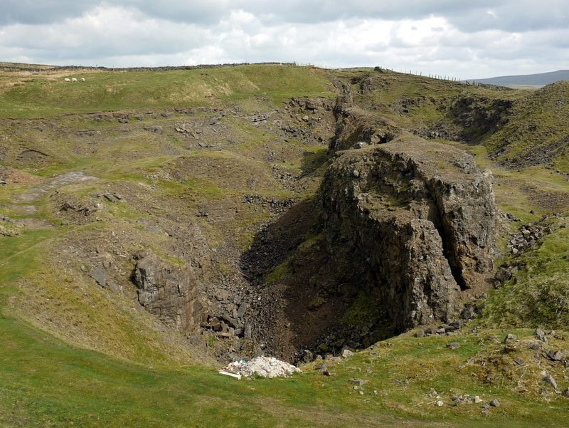 The Slitt Vein exposed at West Rigg Opencut in Weardale, a broad pale band of quartz vein material standing in the face of the old ironstone working.